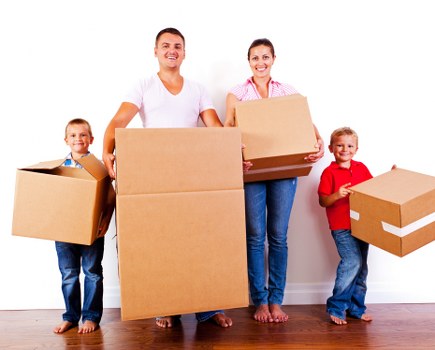 Local movers working in a Beckenham residential street with removal van and boxes