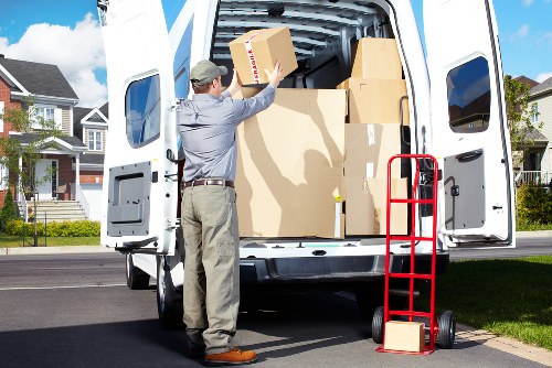 PPE and safe lifting practices used by a Beckenham removals van team